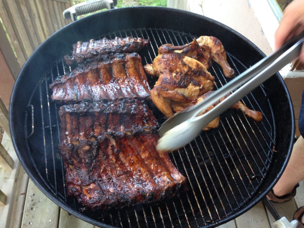 Chicken and ribs on barbecue