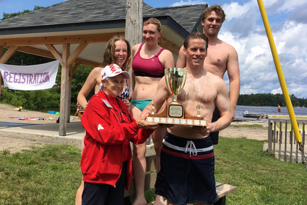 Four swimmer and a trophy