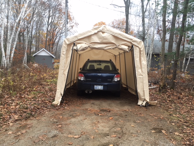 car in a tent garage